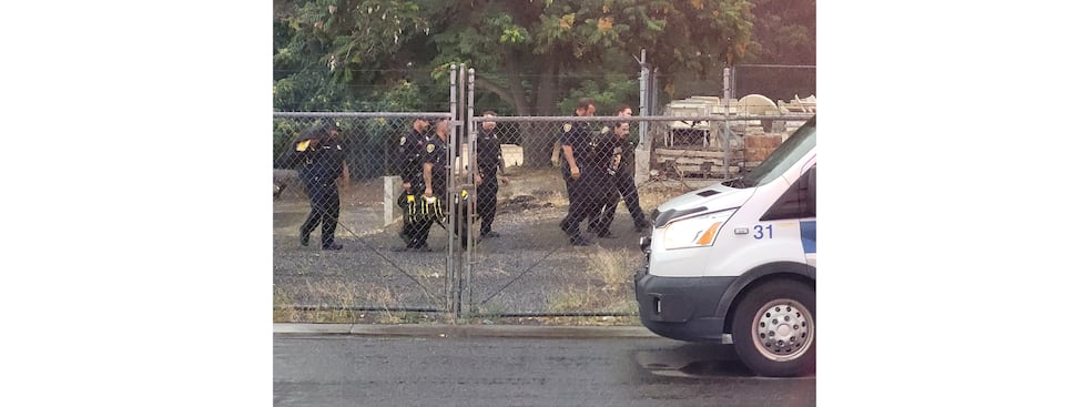 Suspect in custody after getting out of river