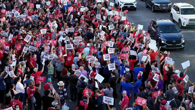 Members of the Culinary Workers Union rally along the Las Vegas Strip, Thursday, Aug. 10,...