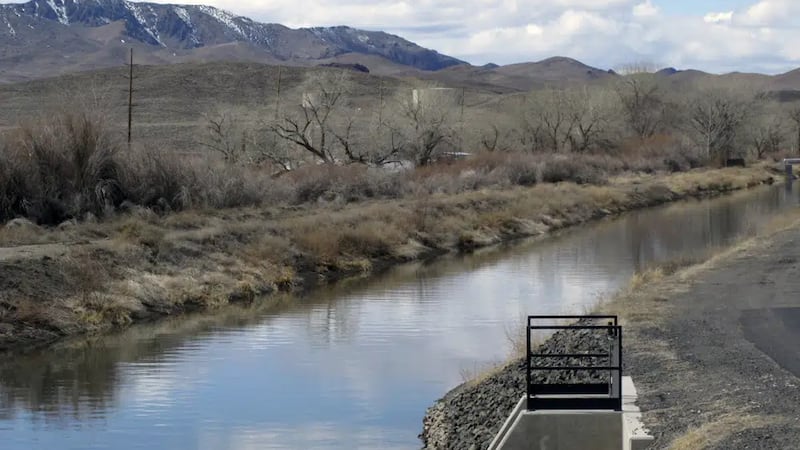 Water is shown in an irrigation canal in Fernley, Nev. near Reno on March 18, 2021. A U.S....
