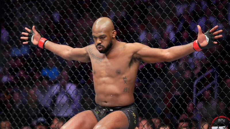 Jon Jones goes through his pre-fight routine in the ring before a light heavyweight mixed...