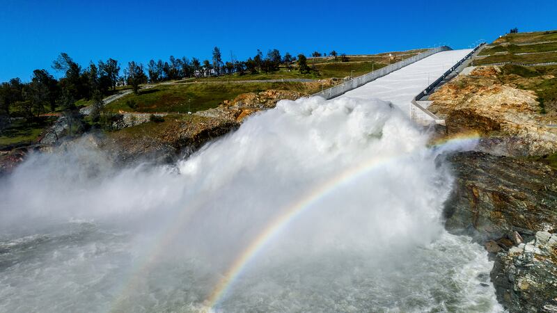 Water rushes out of the Oroville Spillway at Lake Oroville on March 26, 2023, in Butte County,...