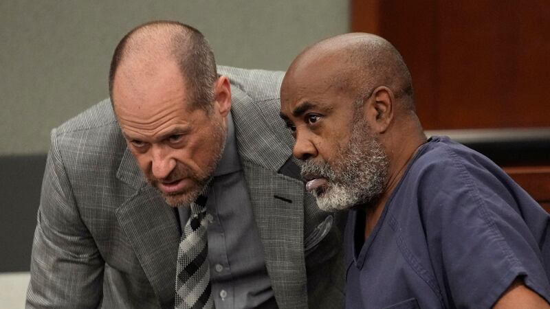 Duane "Keffe D" Davis, right, speaks with attorney Ross Goodman in court Thursday, Oct. 19,...