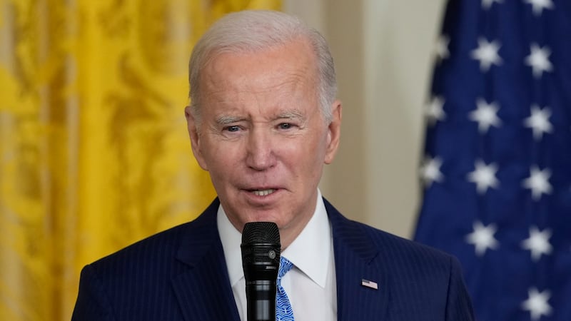 President Joe Biden speaks during a reception in the East Room of the White House in...