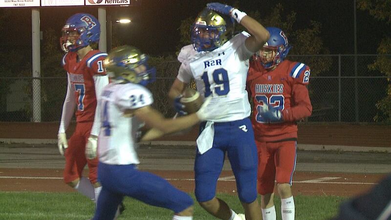 Reed's Xavier Pineda rises above a Reno High defender to snatch a Raider touchdown