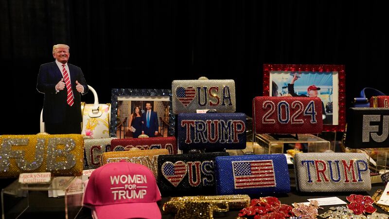 Souvenirs are displayed before former President Donald Trump's keynote speech at the...