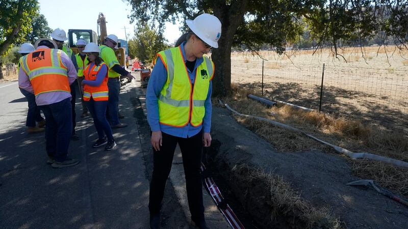 Pacific Gas and Electric CEO Patti Poppe looks down while being interviewed during a tour of...