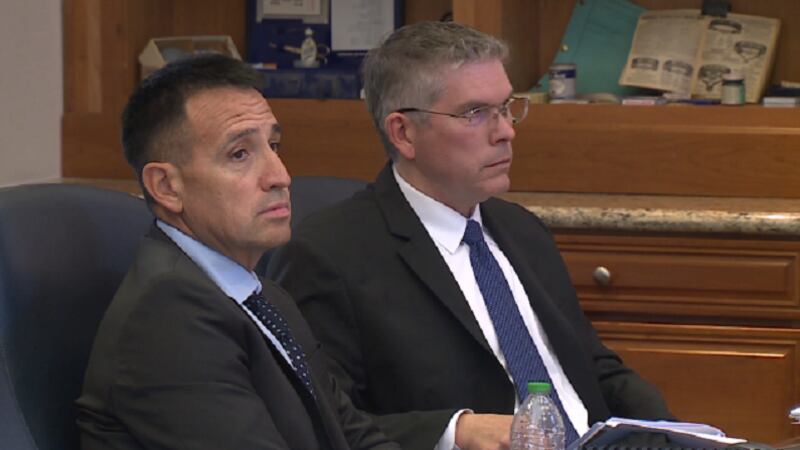 Dr. Samuel Chacon left his attorney Eric Stryker on right