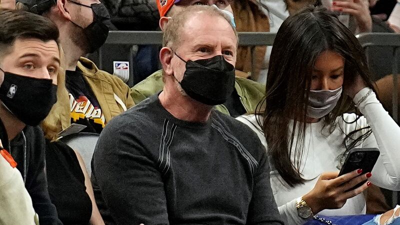 Phoenix Suns owner Robert Sarver watches action during the first half of an NBA basketball...