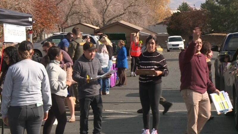 Community volunteers gather outside The Church of Jesus Christ of Latter-day Saint chapel on...