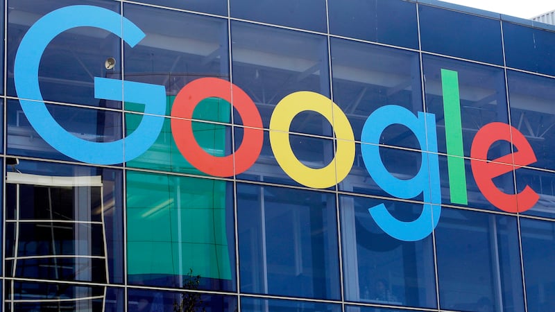 FILE - A sign is shown on a Google building at their campus in Mountain View, Calif., Sept....