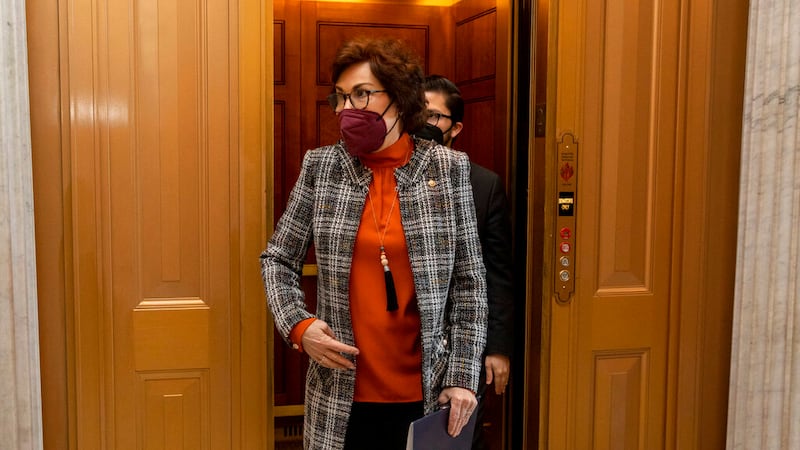 Sen. Jacky Rosen, D-Nev., walks towards the senate floor at the Capitol in Washington,...