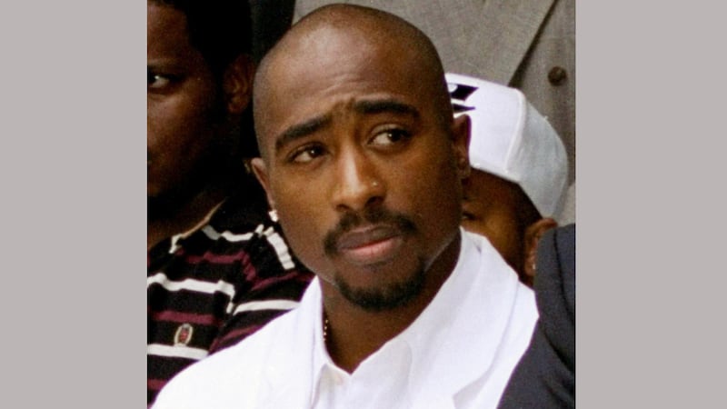 FILE - In this Aug. 15, 1996, file photo, rapper Tupac Shakur attends a voter registration...