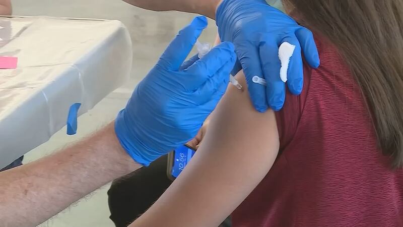 A file image of the COVID vaccine being administered