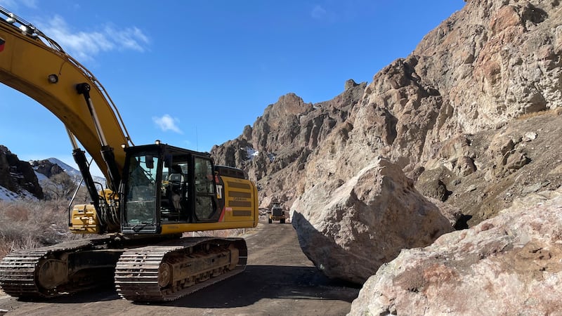 An image of equipment being used to clear the rockslide