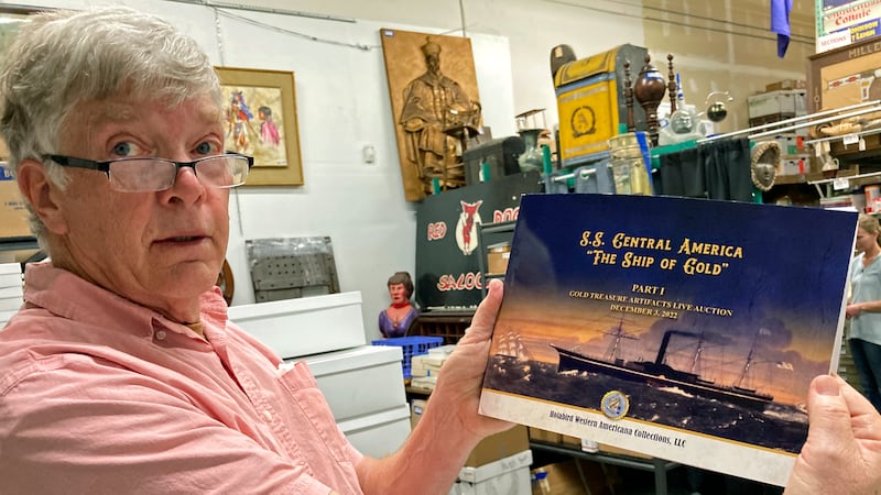 Fred Holabird, president of Holabird Western Americana Collections, poses with a catalog of...