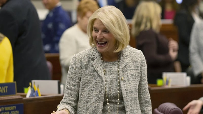 Nevada Republican Assemblywoman Heidi Kasama laughs with lawmakers in Carson City, Nev., Feb....