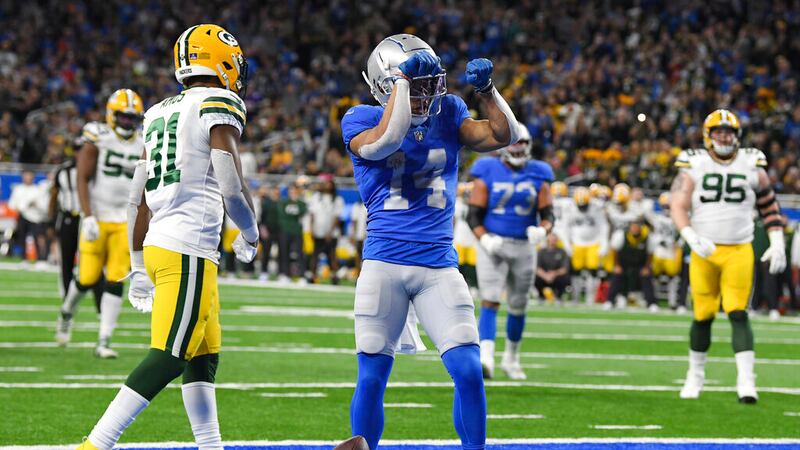 Detroit Lions wide receiver Amon-Ra St. Brown reacts after a 2-yard reception for a touchdown...