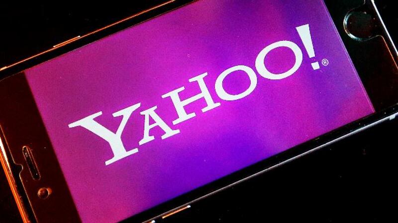 FILE - In this Dec. 15, 2016, file photo, the Yahoo logo appears on a smartphone in Frankfurt....