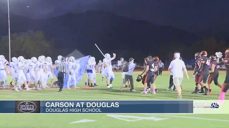 The Carson football team came to midfield in Minden to tussle with the Tigers of Douglas